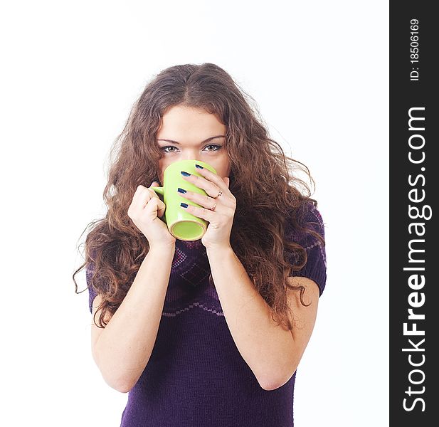Young beautiful woman with a green cup