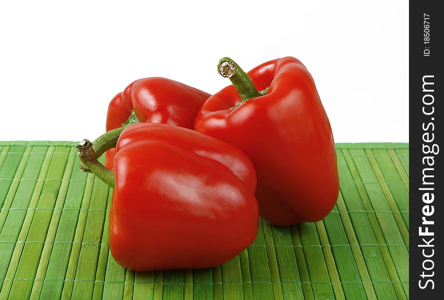 Red bell peppers on green. Red bell peppers on green