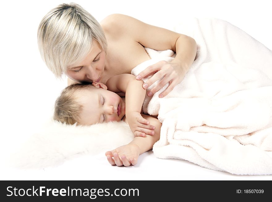 Mother With Baby Are Sleeping In Bed