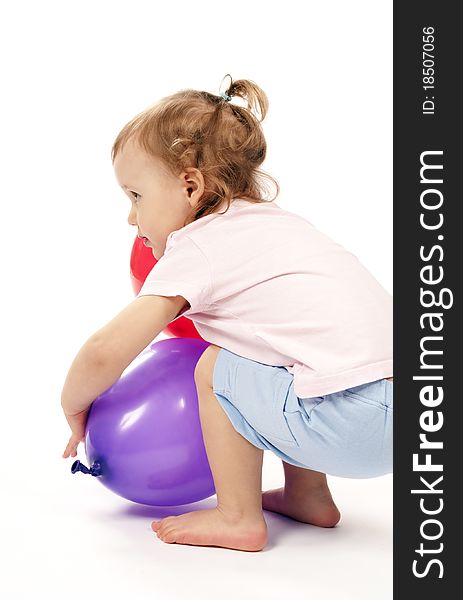 Baby In Studiu Is Playing With Balloons