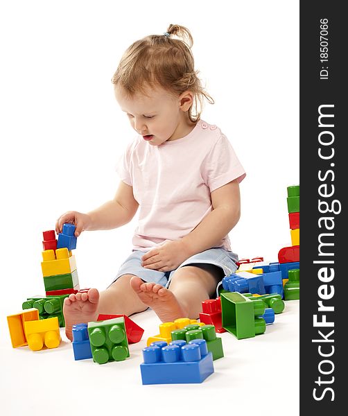 Baby In Studiu Is Playing With Block