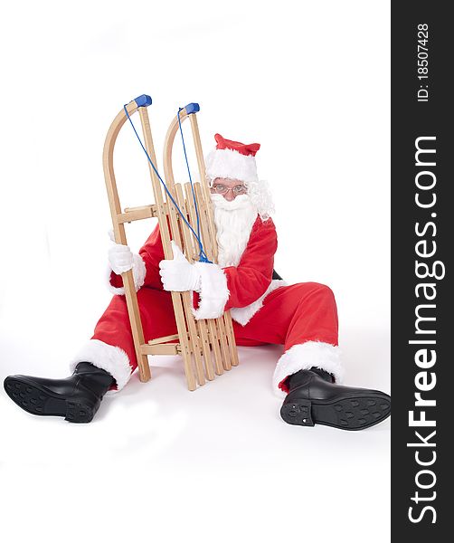 Funny santa with sledge in studio. Funny santa with sledge in studio