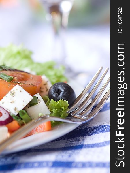 Tasty fresh greek salad on table. Tasty fresh greek salad on table