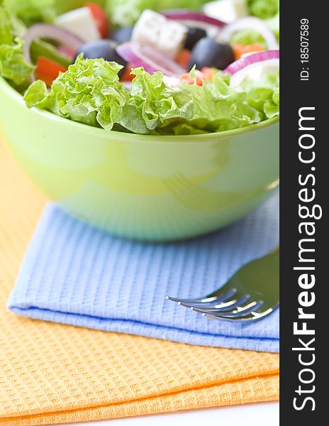 Fresh greek salad in green bowl. Fresh greek salad in green bowl