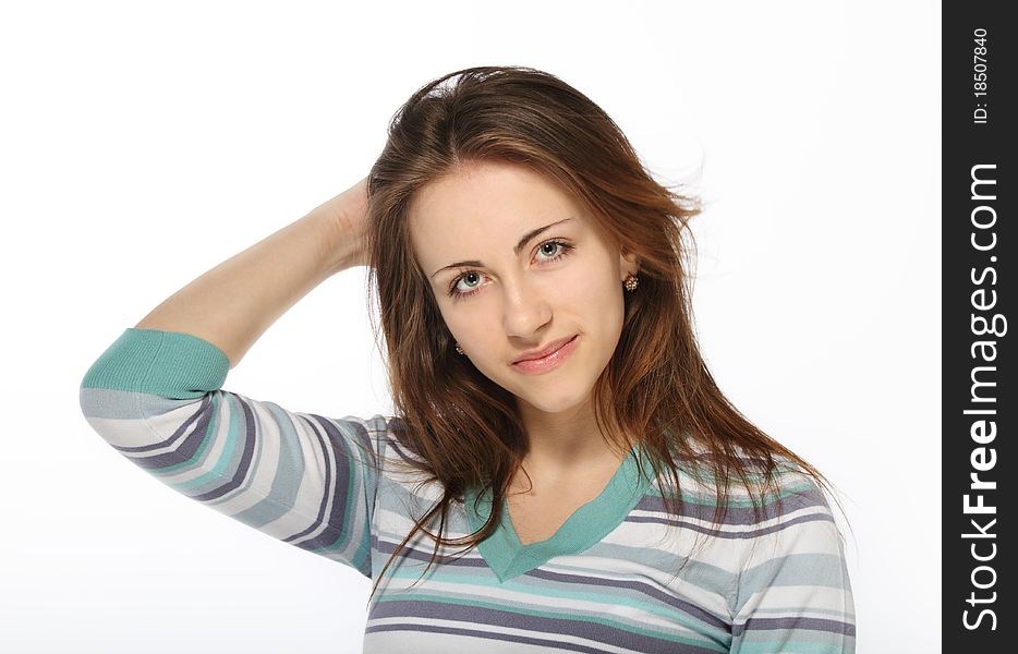 Portrait of young beautiful brunette girl in striped casual jumper
