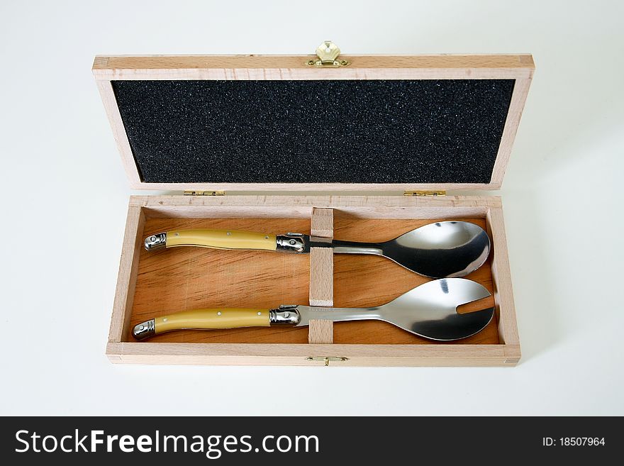 Two salad spoons presented in a wooden case. Two salad spoons presented in a wooden case.
