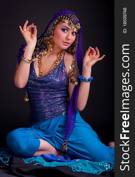 Beautiful girl in a stylized ethnic costume and shawl