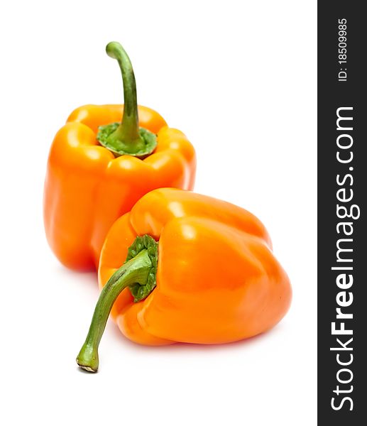 Orange peppers isolated on white background