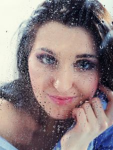 Pretty Lonely Girl Looking To Rainy Window Royalty Free Stock Image