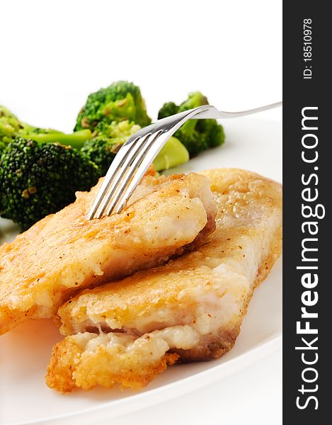 Broccoli and fried fish on white background