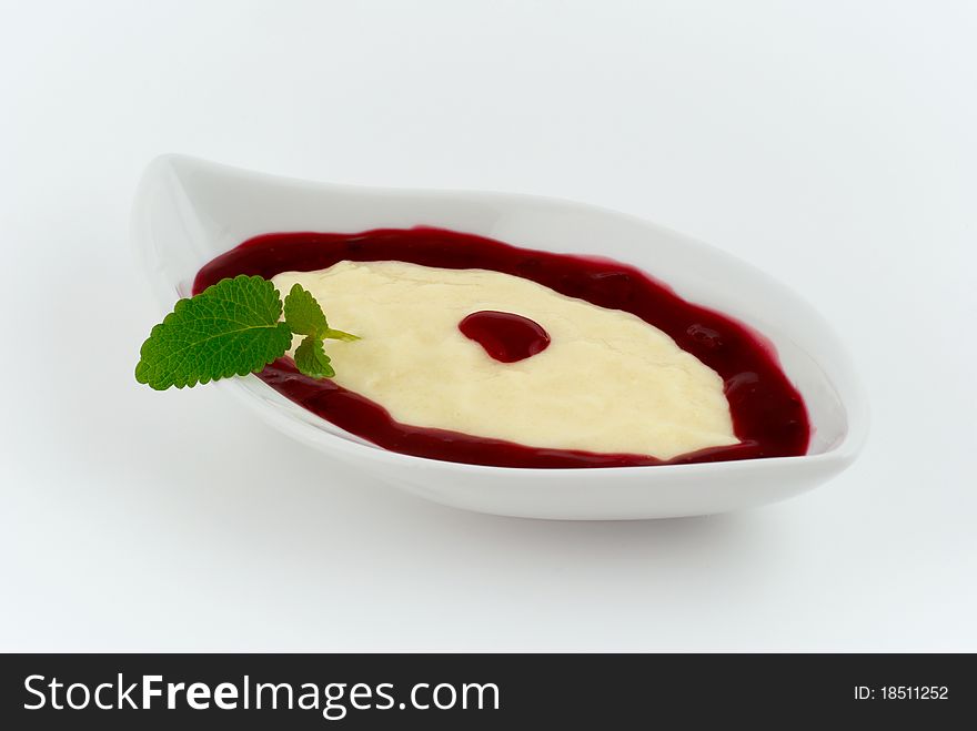 Dessert with strawberry cream on a white plate. Dessert with strawberry cream on a white plate