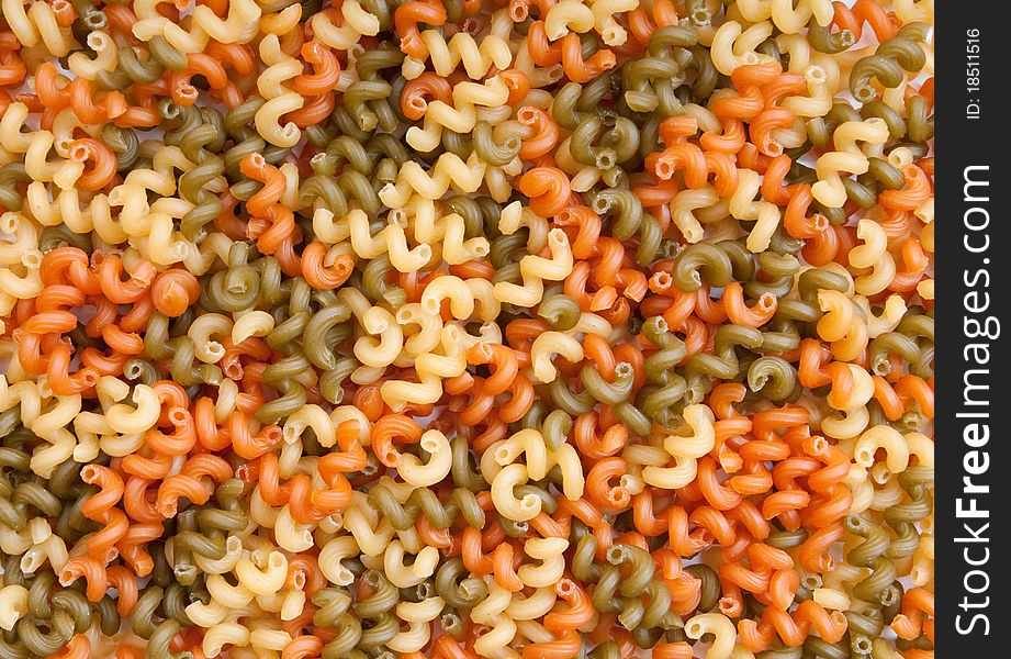 Background texture of colorful pasta