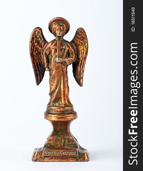 Antique copper statue in the shape of an angel on a white background