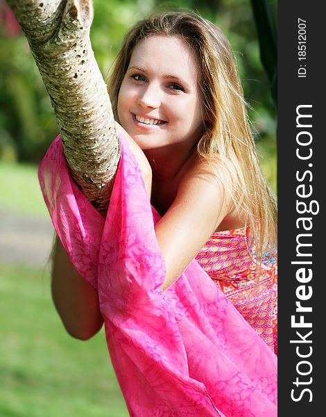 Young beautiful woman relaxing on natural background