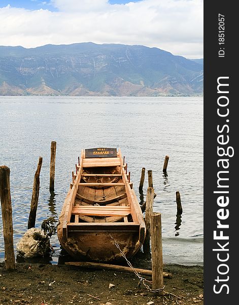 A wooden boat carved from a piece of log at a lake in Yunan, China. A wooden boat carved from a piece of log at a lake in Yunan, China