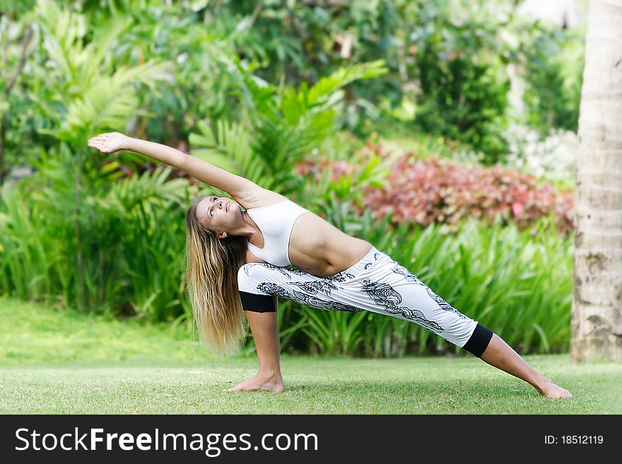 Woman Doing Yoga On Natural Background