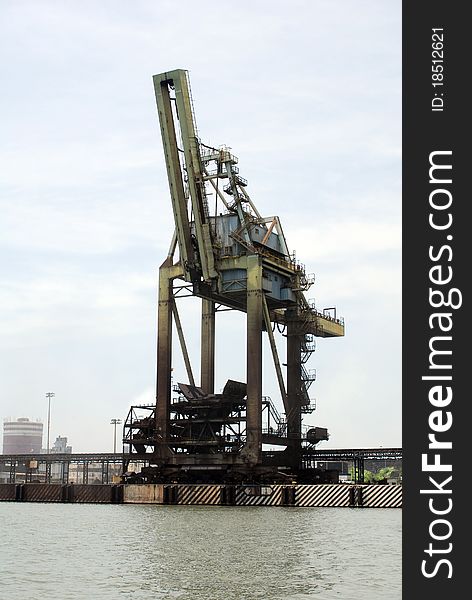 Vertical image of old cargo crane