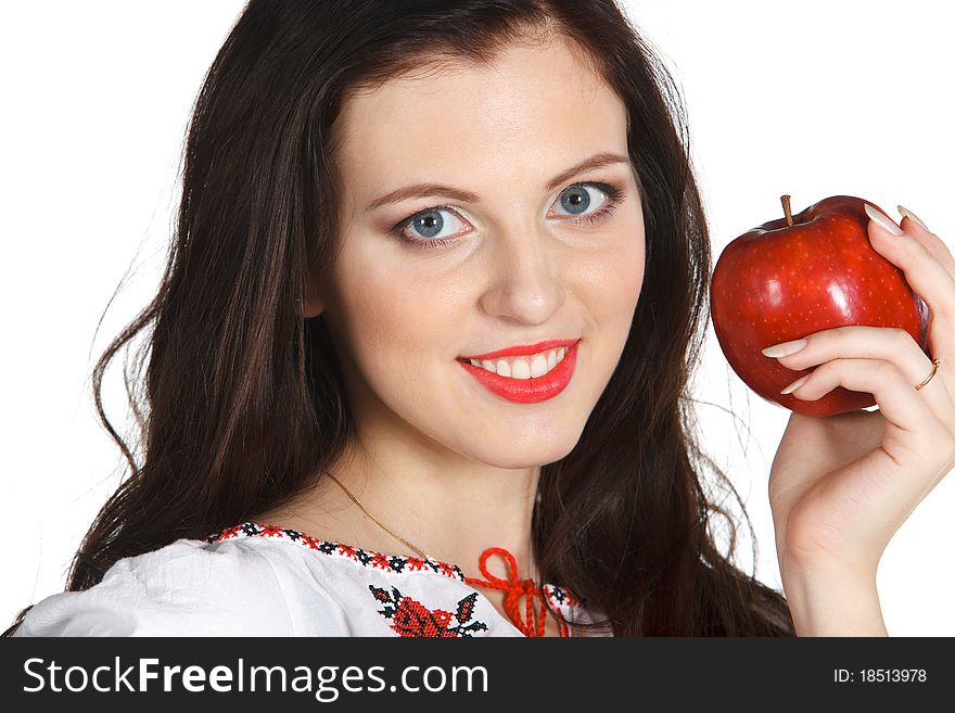 Young female in embroidery chemise holding red apple isolated on white. Young female in embroidery chemise holding red apple isolated on white