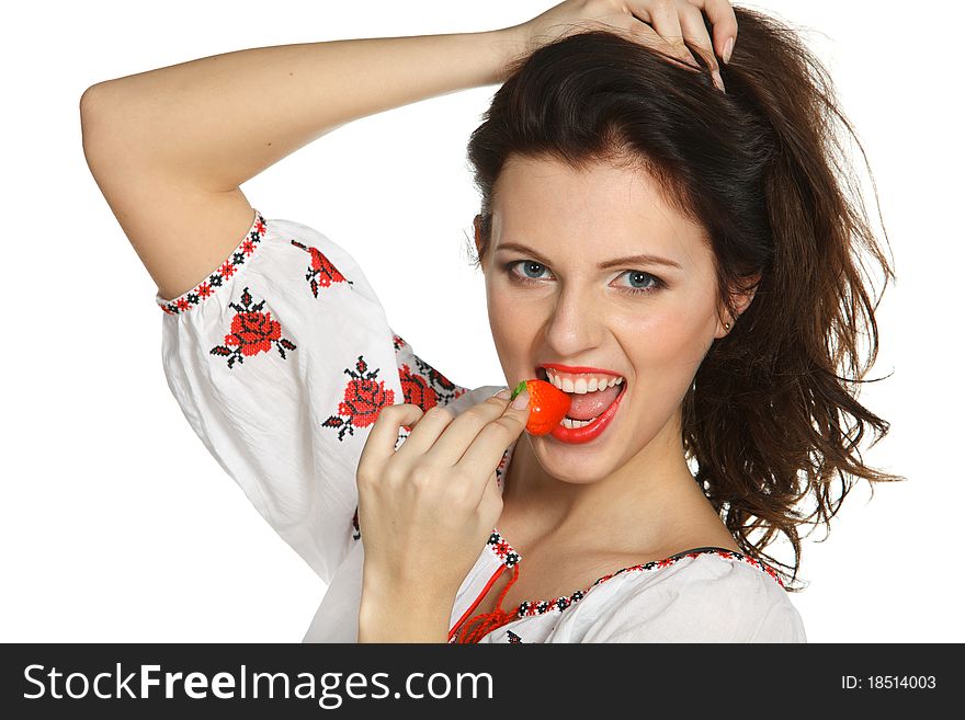 Young female biting a strawberry isolated on white. Young female biting a strawberry isolated on white