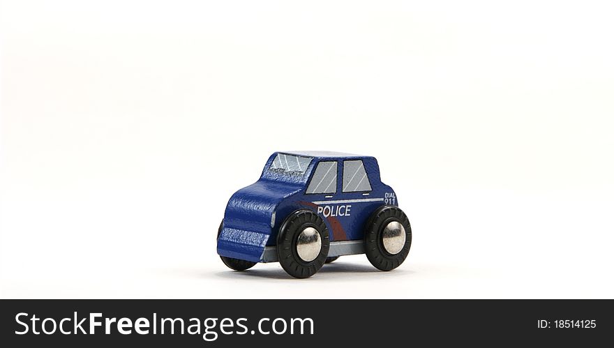 Wooden toy Police car on white background