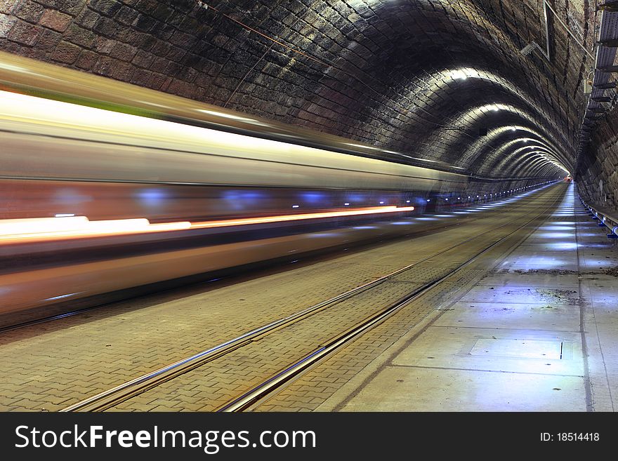 A train disappearing into a tunnel