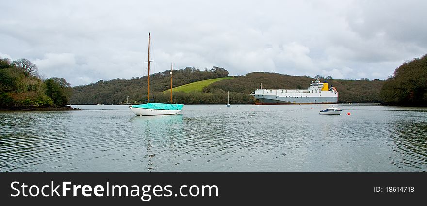 Ships of varying size lying at anchor on the River Fal. Ships of varying size lying at anchor on the River Fal