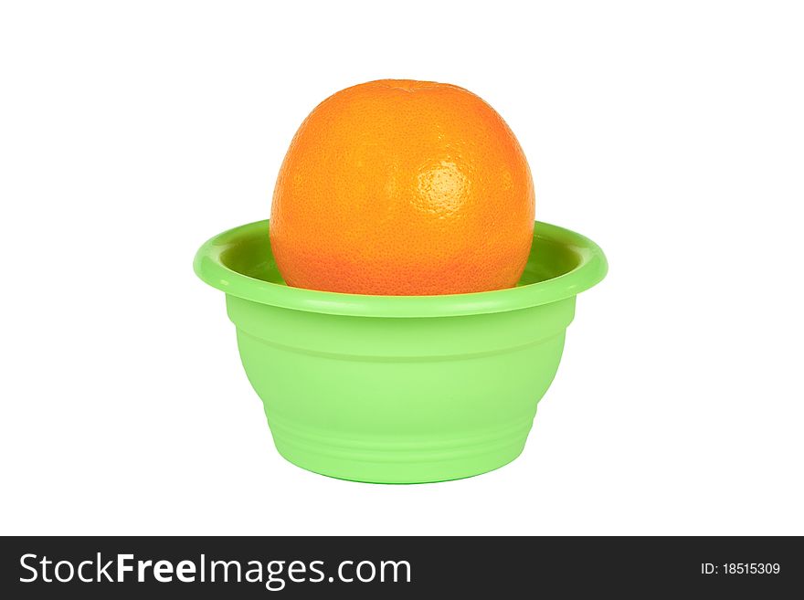 Big orange growing in a green flower pot. Big orange growing in a green flower pot