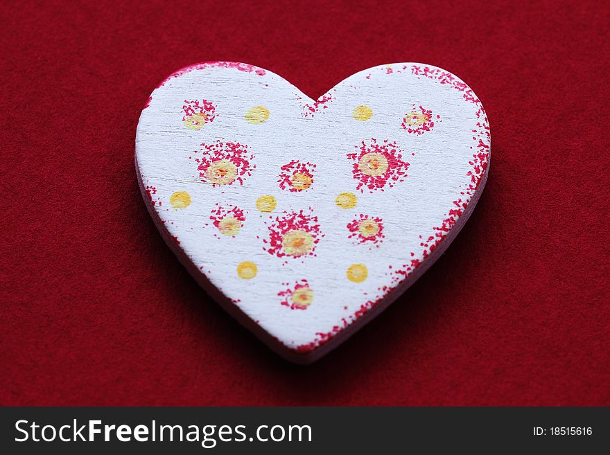 Patterned white heart on red background