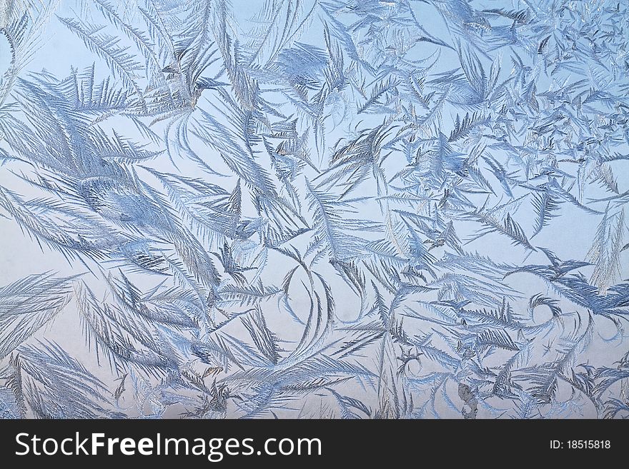 The abstract frosty pattern on glass