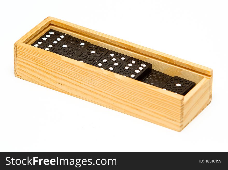 Dominos in a wooden box isolated on white background