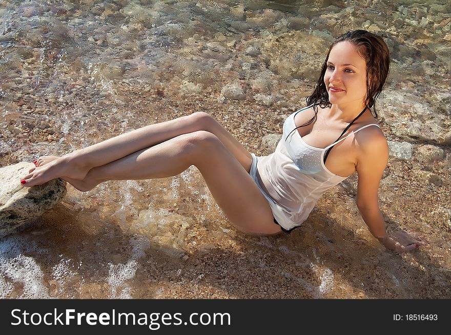 Beautiful young brunette woman on the sea beach. Beautiful young brunette woman on the sea beach