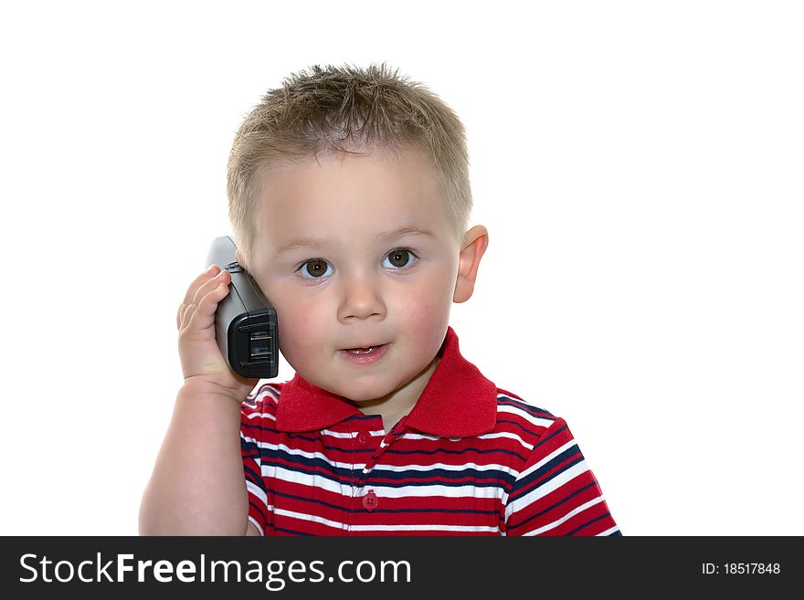 Cute little boy in business shirt with cell phone. Cute little boy in business shirt with cell phone