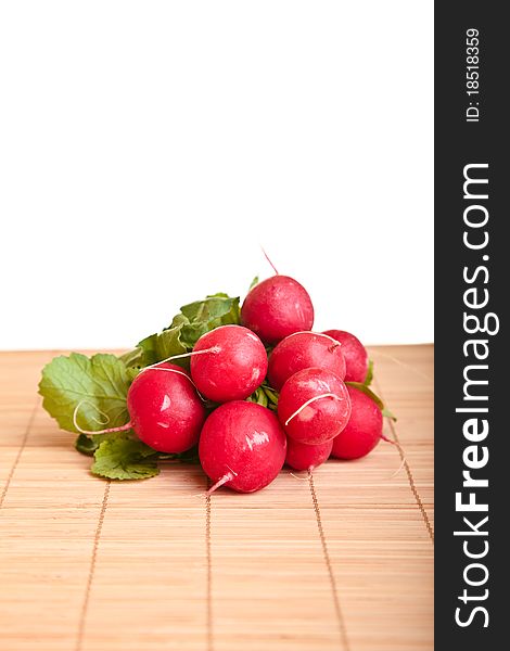 Different ripe vegetables composition in studio laying on bamboo plate