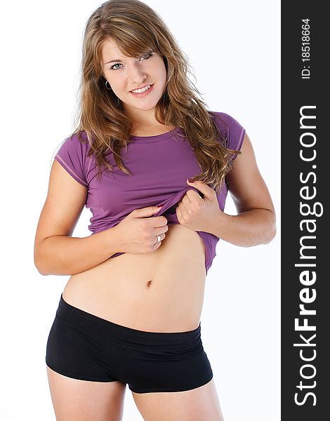 Young woman poses wearing her fitness outfit. Young woman poses wearing her fitness outfit.