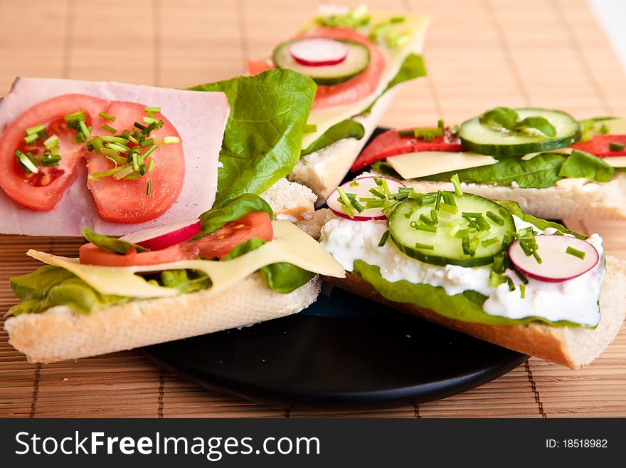 Different sandwiches with vegetables and cheese isolated