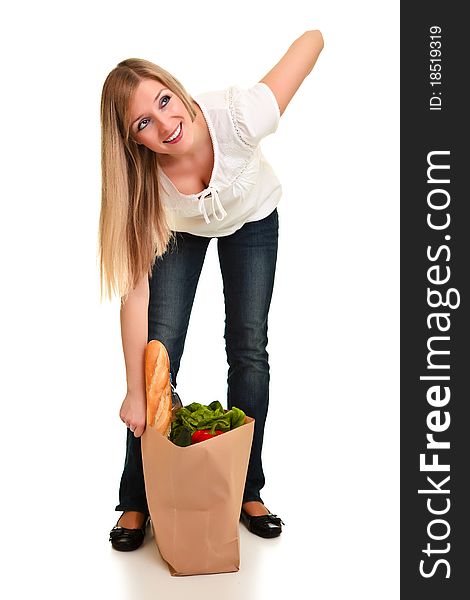 Woman carrying bag of groceries isolated on white