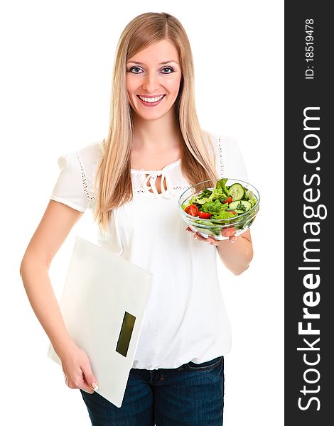 Woman with salad and scales isolated on white