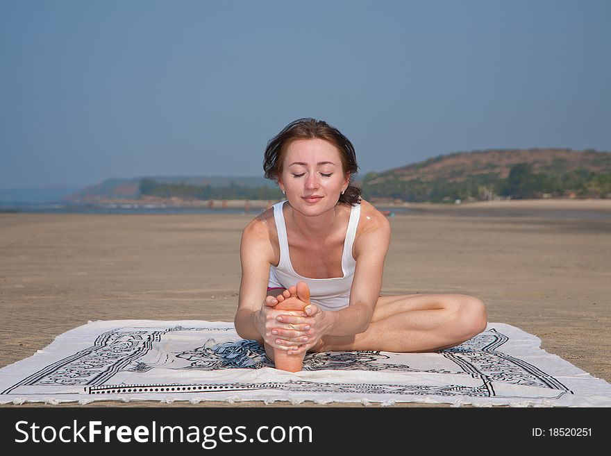 Young woman doing yoga in goa, india. Young woman doing yoga in goa, india