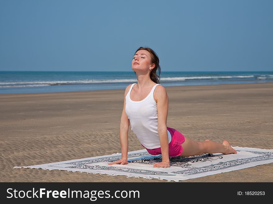 Young woman doing yoga in goa, india. Young woman doing yoga in goa, india