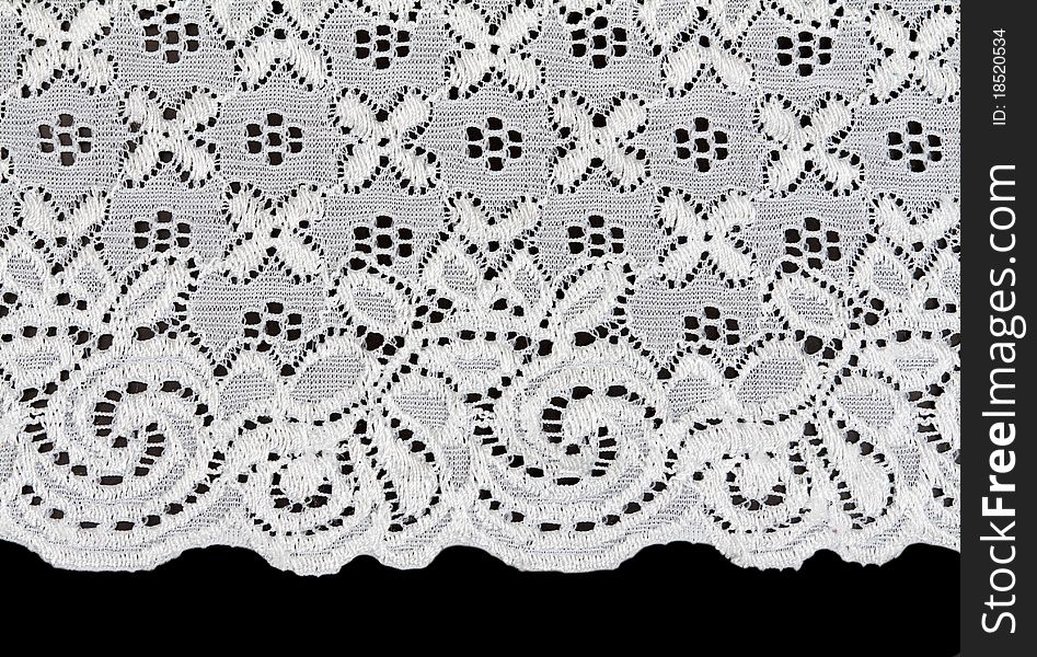 White lace with a floral pattern on a black background