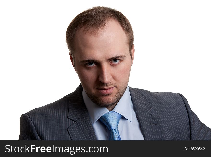 Portrait of an unshaven businessman in a gray suit with a white background