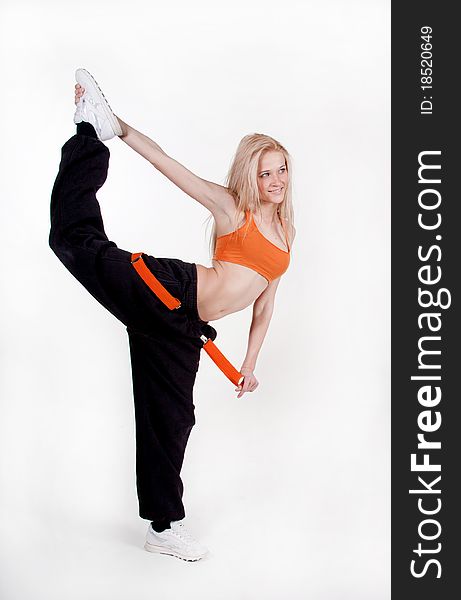 Studio shot of modern style dancer posing over white