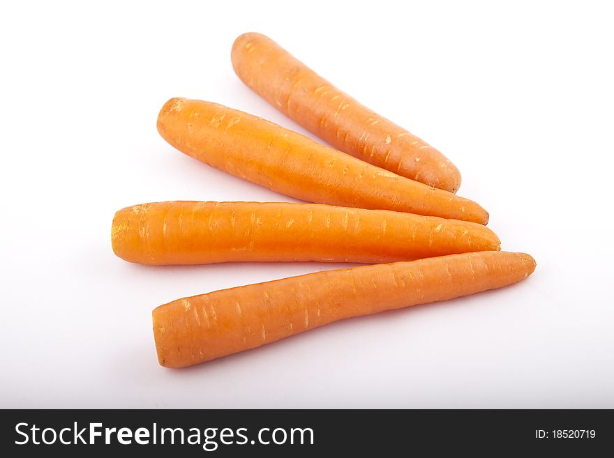 Four carrots on a white background