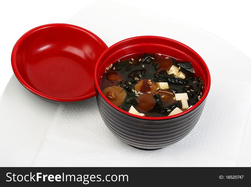 Mushroom soup in a beautiful bowl isolated on a white background