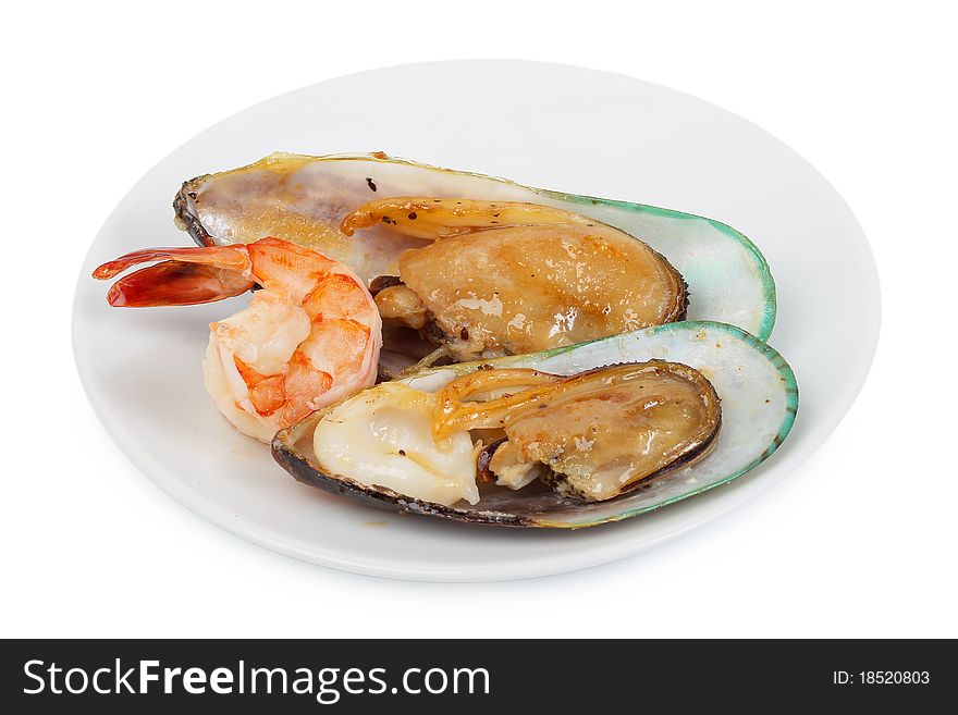 Delicatessen dish with tiger shrimps, mussels