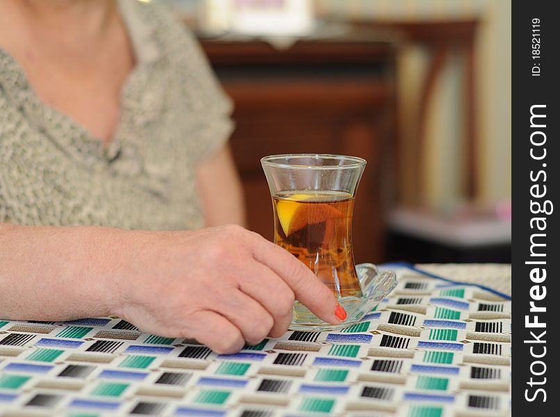 A senior woman drinking tea. A senior woman drinking tea