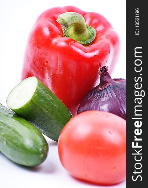 Fresh vegetables on the table with water drops.