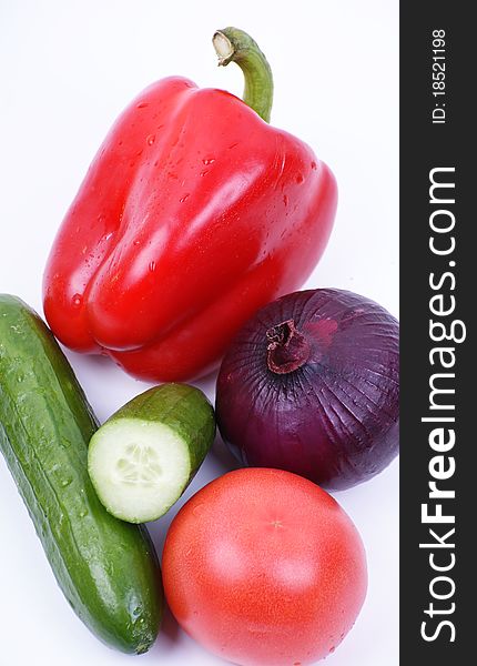 fresh colored vegetables on white background