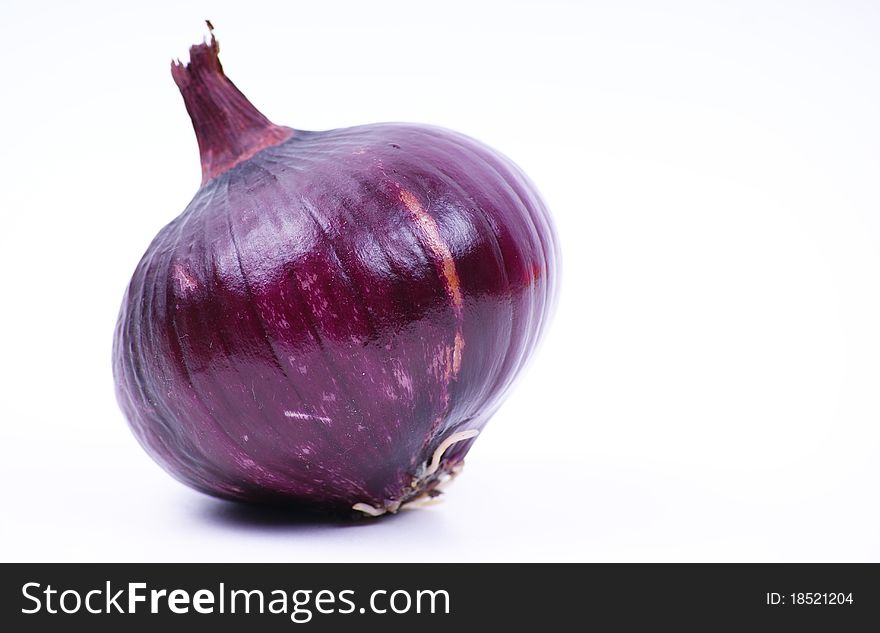 Alone violet onion on white background