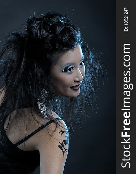 Gothic asian girl on black background